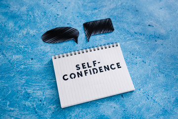 positive attitude concept, Self-confidence text on notepad with comic bubbles of different shape...