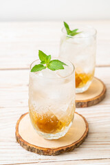 iced plum juice with soda and peppermint
