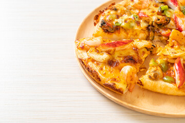 seafood pizza on wood tray