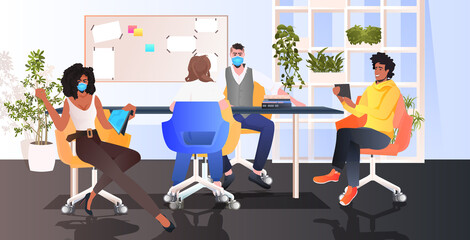 Obraz na płótnie Canvas mix race businesspeople working in modern office teamwork coronavirus quarantine concept