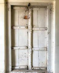 An Old ancient door painted white