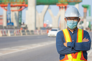 Portrait  senior Asian man wear face mask standing on site construction background , Old man wear mask protect coronavirus covid19