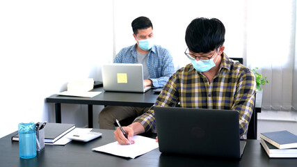 new normal business practise business people have a meeting worker wearing face protective mask at coworking space, Health and teamwork concept.