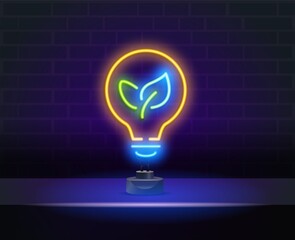 Glowing neon sign of green, eco energy. Glowing neon line Electric saving plug in leaf icon isolated on brick wall background. Save energy electricity. Environmental protection. Bio energy.