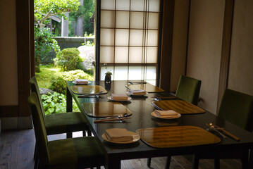 Wooden table in a Japanese restaurant with beautiful outdoor scenery	
