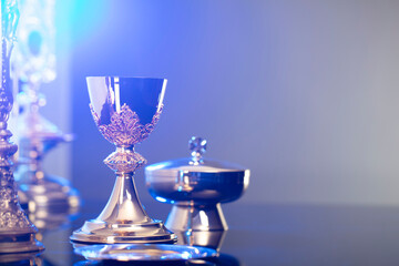 Religion theme – Easter. Catholic symbols composition. The Cross, monstrance  and golden chalice...