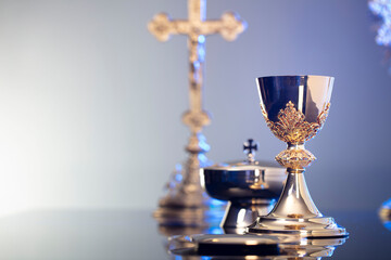 Religion theme – Easter. Catholic symbols composition. The Cross, monstrance  and golden chalice...