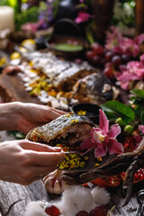 Still life in old masters style with fish, glass of wine, old dishes, fruits. The concept of a richly decorated table.