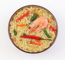 Chinese noodles with vegetables, soy sauce on a white plate
