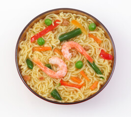 Chinese noodles with vegetables, soy sauce on a white plate