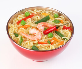 Chinese noodles with vegetables, soy sauce on a white plate