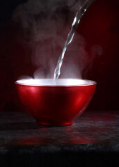 Chinese noodles with red pepper on black background