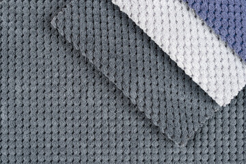 Close-up of a gray textured fabric. Macro shot of gray upholstery for furniture.