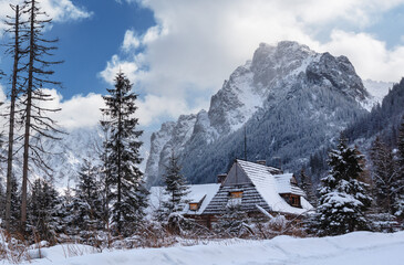 Fototapeta premium Beautiful winter views of the High Tatra Mountains with tourists, skiers and amazing states of nature