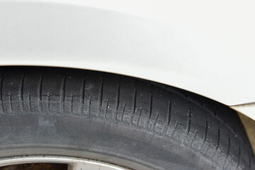 Old tire with worn tread and scratch, worn old car tire tread with damaged, scratch, worn tire...