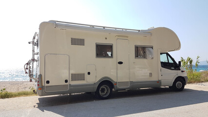 caravan trailer car by the sea in summer holidays