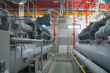 Inside of Industry factory. Chiller tower or cooling tower in building. System work machine....