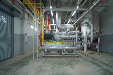 Inside of Industry factory. Chiller tower or cooling tower in building. System work machine....