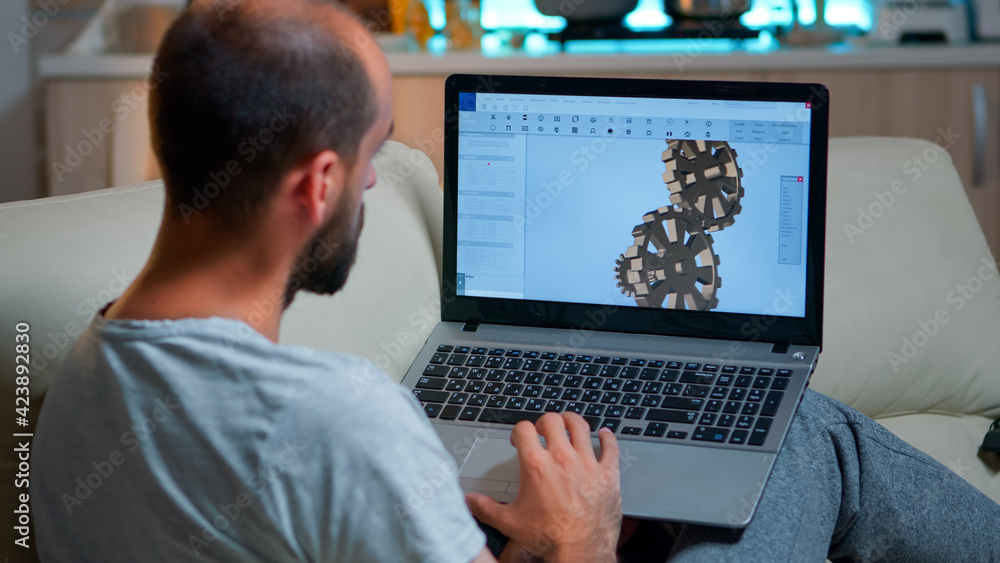 Poster focused architect looking at laptop computer for nerw development of technical construction prototyp