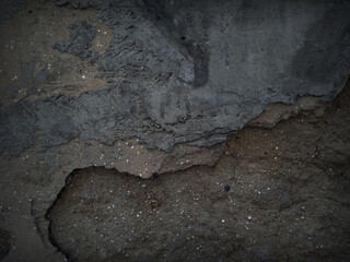 The shadow of the old gray cement wall surface with cracks