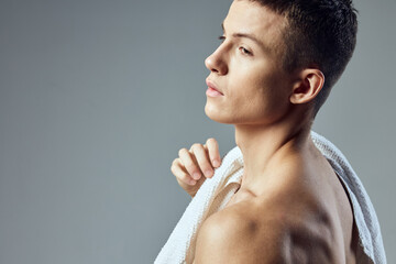 handsome man cropped view of towel on shoulders fitness workout close-up