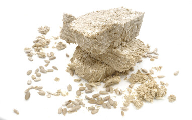 Halva cut into large pieces isolated on white background