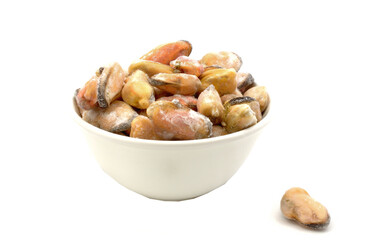 Fresh frozen mussels sprinkled in white plate isolated on white background