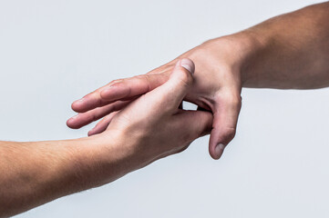 A friendly handshake. Two hands, shaking hands. Two hands, helping arm of a friend, teamwork....