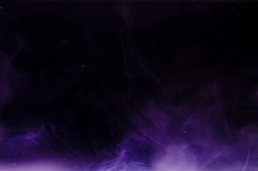 Ink swirls underwater. Ink cloud isolated on black background. Abstract effect of explosion of cosmos universe smoke with particles.