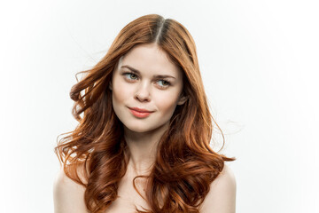 Fototapeta premium cheerful woman attractive look naked shoulders loose hair light background