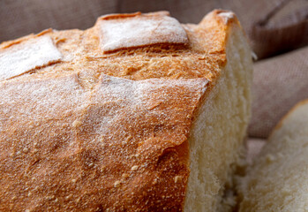 White bread bun fragment, side view. Art bread.