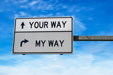 Road sign with words your way and my way. White two street signs with arrow on metal pole....