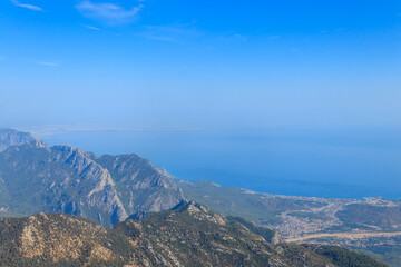 Fototapeta premium View of the Taurus mountains and the Mediterranean sea from a top of Tahtali mountain near Kemer, Antalya Province in Turkey