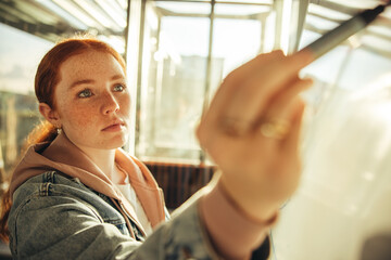 Female student writing on whiteboard