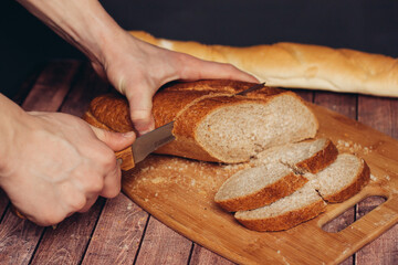 slicing a loaf on a cutting board kitchen eating breakfast fresh smell