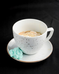 Coffee with ice cream close up shot. Over black background.