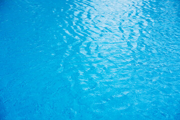 Blue ripped water in swimming pool. water surface background.