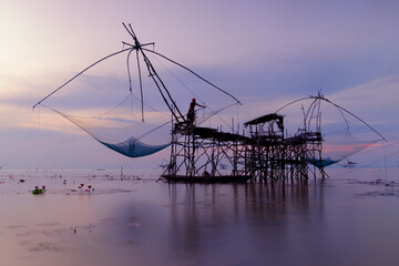 Silhouette fisherman with sunrise (Thailand)