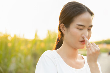 woman practicing yoga breathing technique, concept of surya bheda pranayama, the sun breathing with...