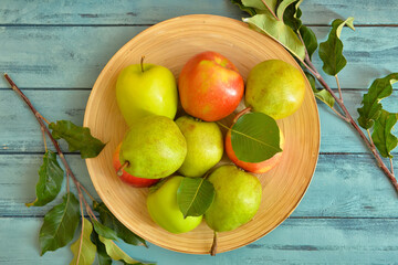 Tray with tasty apple and pear fruits on table