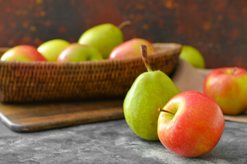 Tasty apple and pear fruits on table