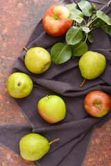 Tasty apple and pear fruits on color background