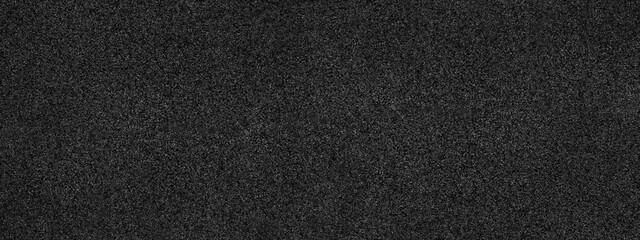 Black abstract background. Concrete wall finished with marble chips. Black stone background with...