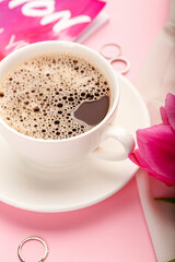 Cup of coffee on color background