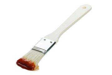 Brush with barbecue sauce isolated on white background