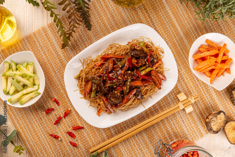 Poster flat lay of fried noodles with beef