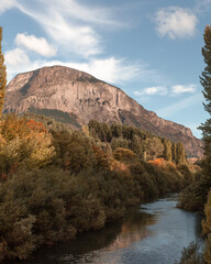 Ride next to big river on sunny day in autumn.
