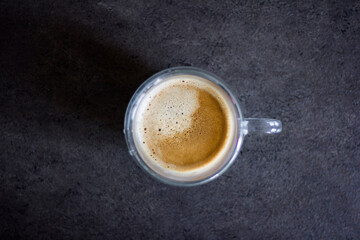 Glass cup of coffee, flat lay view