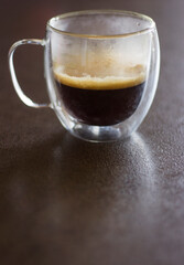 Glass cup of coffee, close up