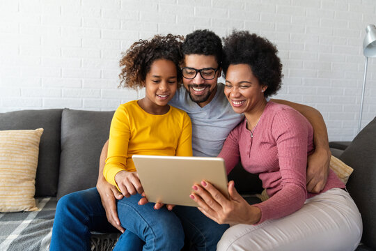 Black family studying and learning from home for online school during coronavirus